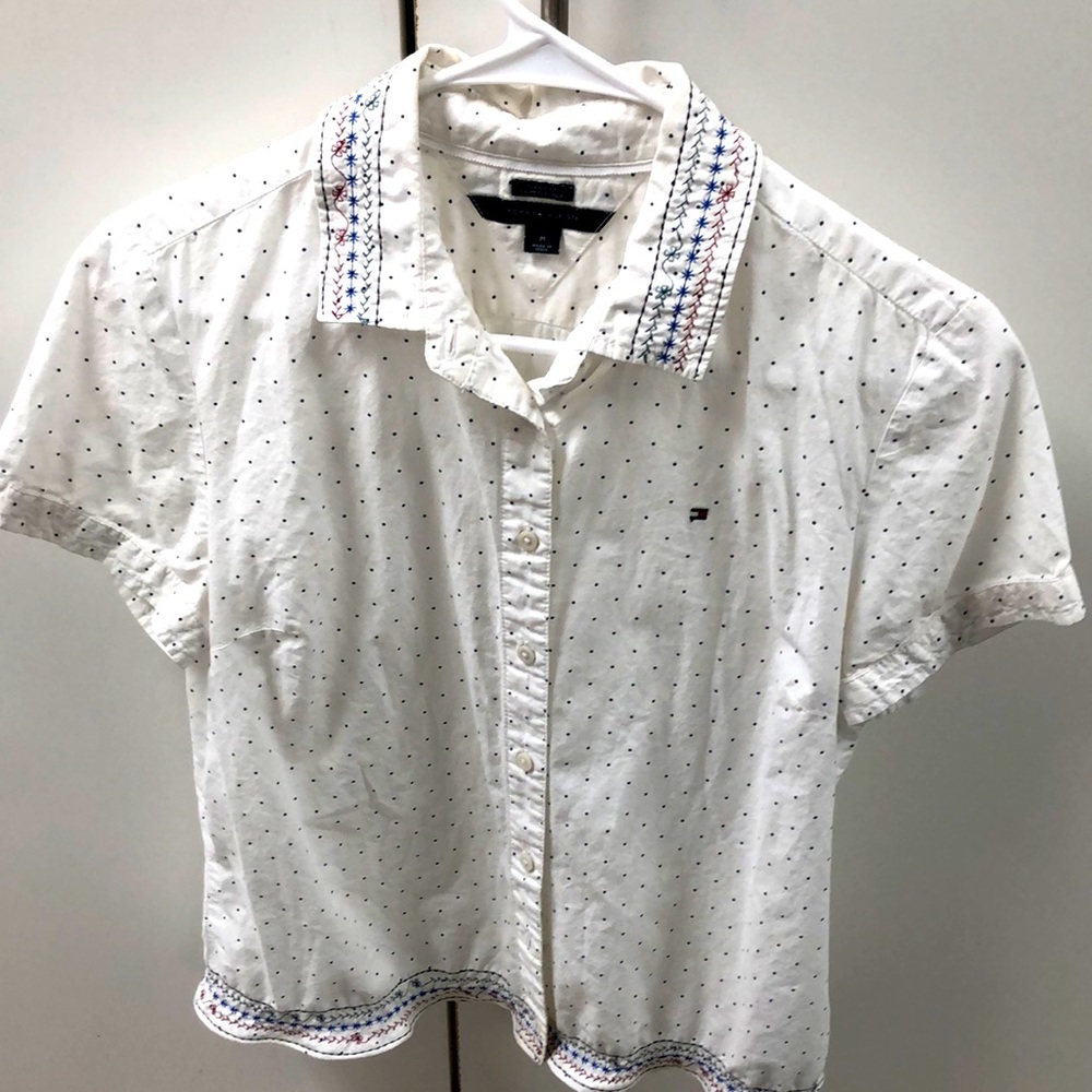 This is a girl’s custom embroidered shirt that is one of a kind